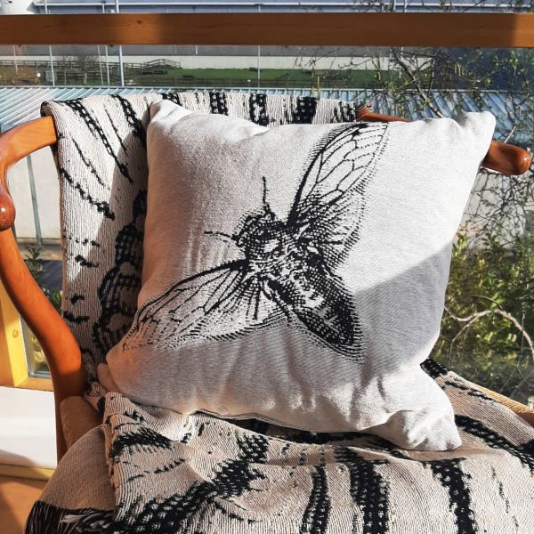 The Cicada Cushion design with the Ernst Shell Throw, the perfect combination.